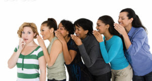 Women whispering --- Image by © Image Source/Corbis