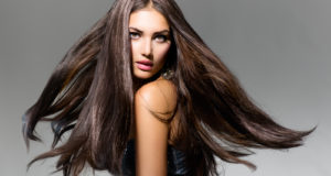 Fashion Model Girl Portrait with Long Blowing Hair. Glamour Bea
